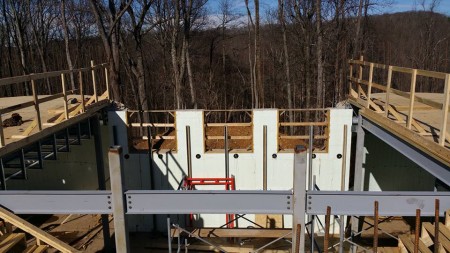 The great hall as seen from the central staircase. The balconies to the left and right are permanent, the great hall has a double story ceiling, 24 feet total. The three windows in the background will eventually be 14 feet tall. 